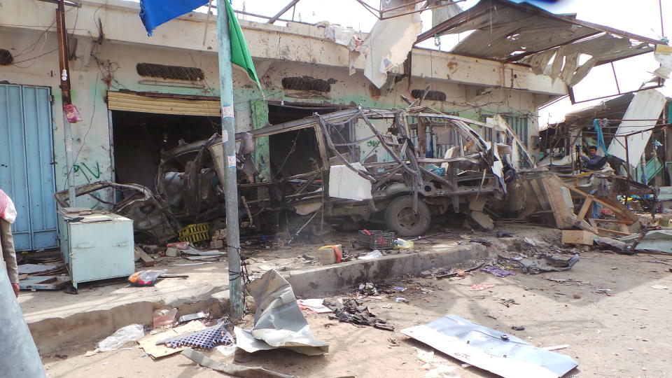 The wreckage of a bus remains at the site of an airstrike in Saada, Yemen on Friday, Aug. 10, 2018. Yemen's Shiite rebels are backing a United Nations' call for an investigation into a Saudi-led coalition airstrike in the country's north that killed dozens of people the previous day, including many children.(AP Photo/Kareem al-Mrrany)