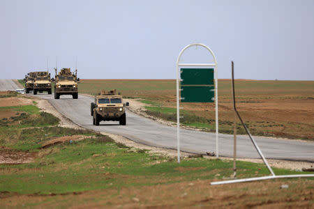 FILE PHOTO: U.S. troops patrol near Turkish border in Hasakah, Syria, November 4, 2018. REUTERS/Rodi Said/File Photo