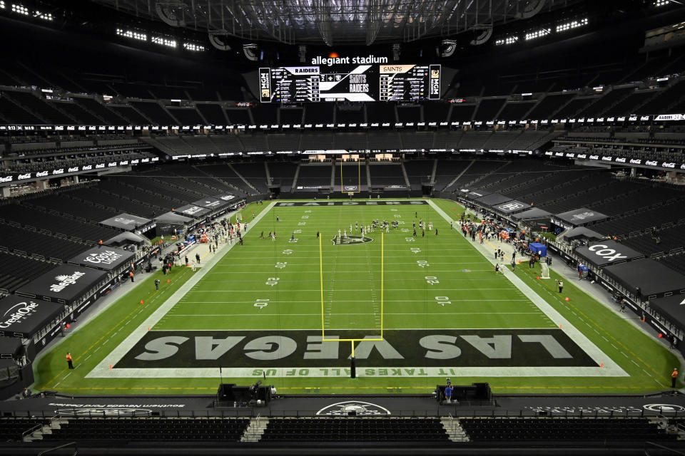 FILE- In this Sept. 21, 2020, file photo, the Las Vegas Raiders play against the New Orleans Saints during an NFL football game in Las Vegas. The Raiders were the first team to play inside Allegiant Stadium. But the UNLV Rebels will be the first team to play with fans inside the $2 billion dollar venue, when they host in-state rival Nevada on Saturday, Oct. 31, 2020. (AP Photo/David Becker, File)