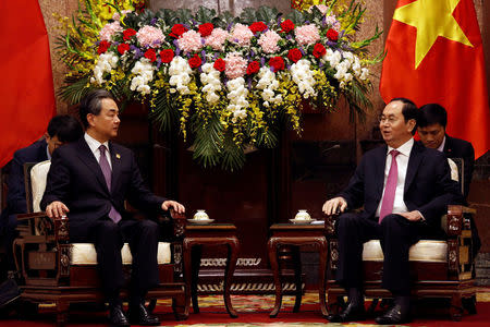China's State Councilor and Foreign Minister Wang Yi and Vietnam's President Tran Dai Quang talk at the Presidential Palace in Hanoi, Vietnam April 1, 2018. REUTERS/Kham