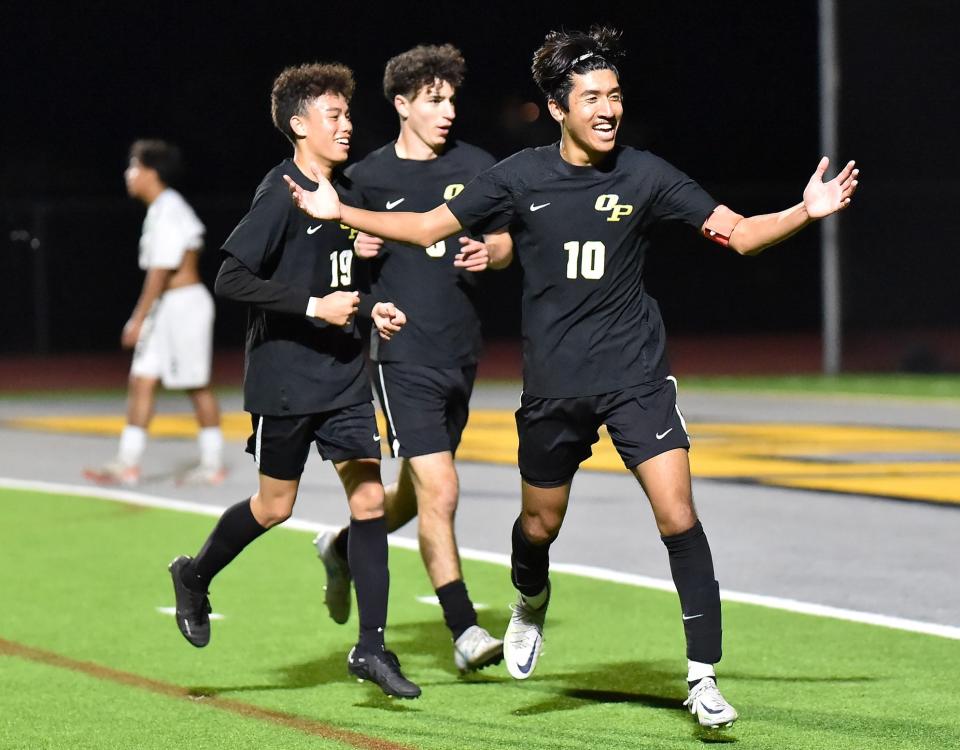 Oak Park's Charles Chowana (10) celebrates after scoring a goal during the Eagles' 4-0 victory over Royal in a Coastal Canyon League match on Wednesday, Jan. 24, 2024.