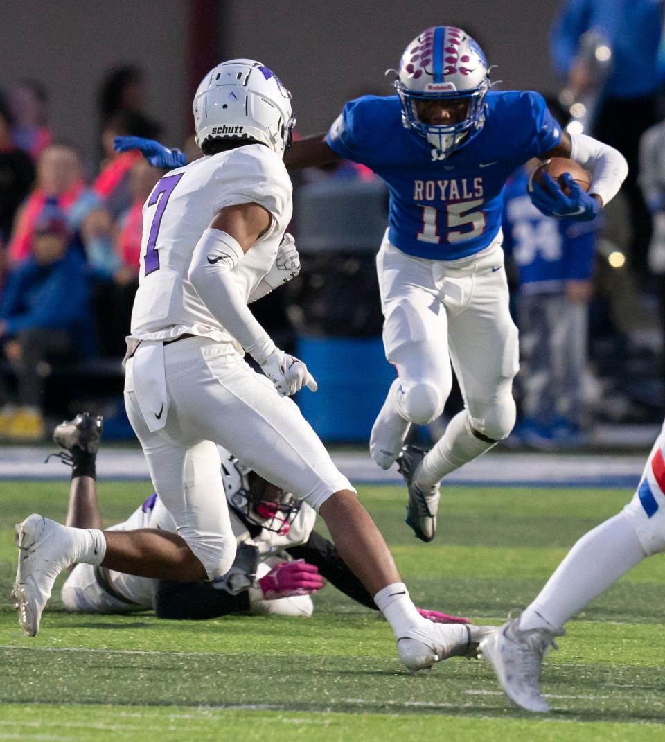 Hamilton Southeastern Royal Mason Alexander (15) jumps over a Brownsburg player Friday, Oct. 14, 2022, in Fishers. 