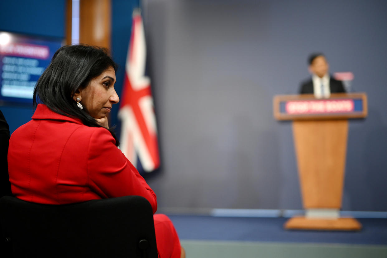 Home Secretary Suella Braverman listens as Prime Minister Rishi Sunak speaks during a press conference following the launch of new legislation on migrant channel crossings at Downing Street on March 7, 2023 in London.