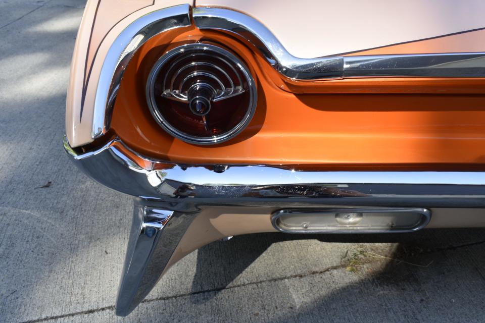 Simple chrome, metal and glass elegance grace the taillight area on Norman Noe's 1961 Oldsmobile