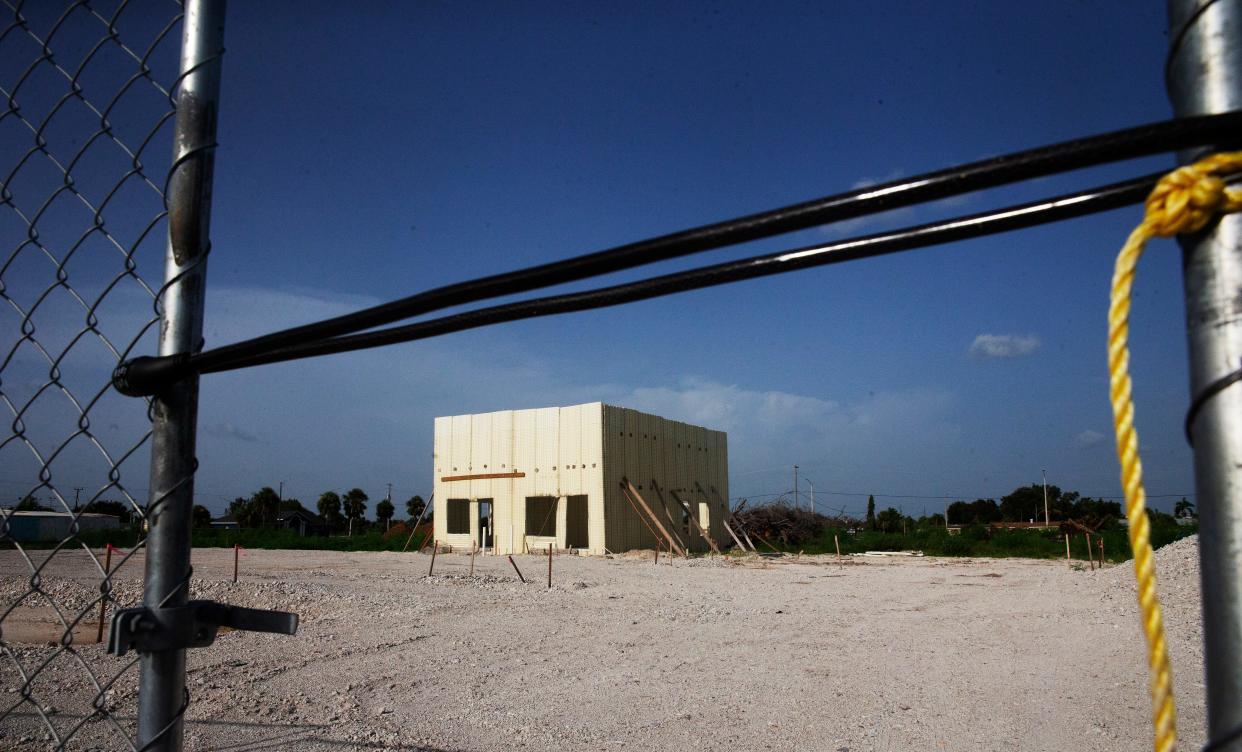 A makeshift structure stands on the property where the Towles Gardens apartment complex is supposed to be built. Work has stopped because of a dispute between the contractor and the developer.