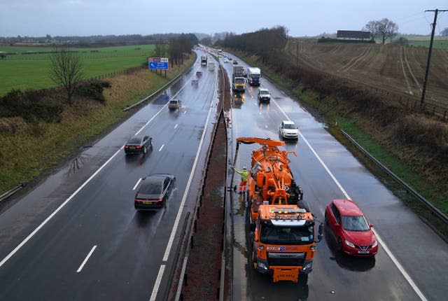 Police in attendance as flood water is cleared from the M9 at Stirling