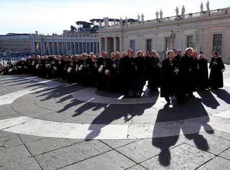 Members of the Order of the Knights of Malta arrive in St. Peter Basilica for their 900th anniversary at the Vatican February 9, 2013. REUTERS/Alessandro Bianchi/File Photo