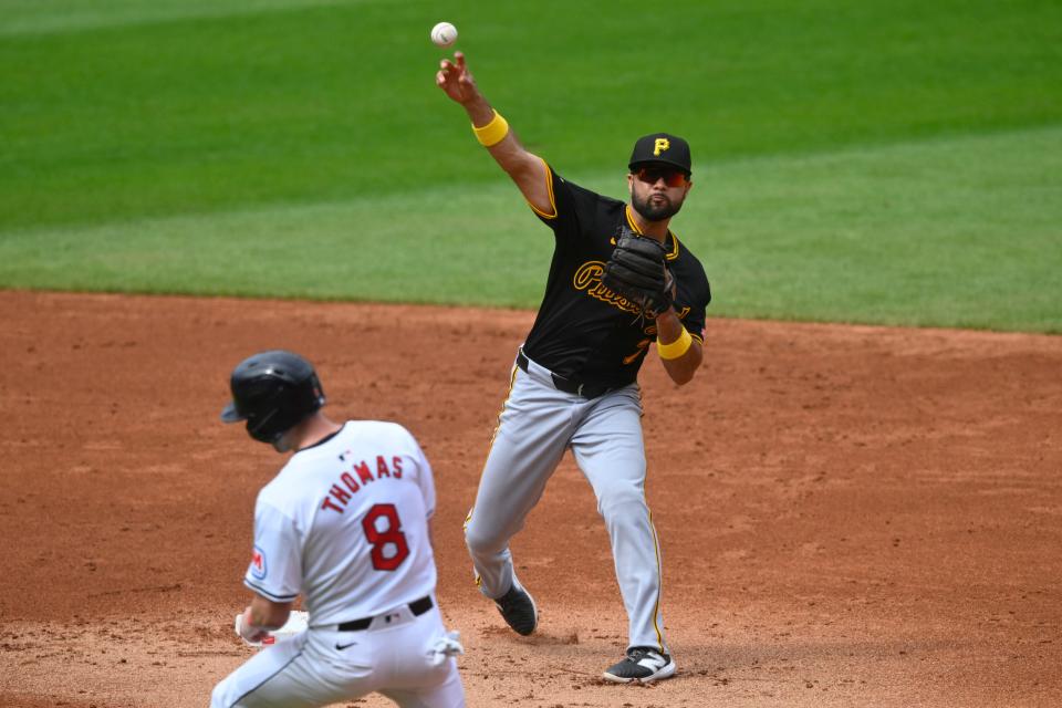 Sep 1, 2024; Cleveland, Ohio, USA; Pittsburgh Pirates shortstop Isiah Kiner-Falefa (7) turns a double play beside Cleveland Guardians center fielder Lane Thomas (8) in the second inning at Progressive Field. Mandatory Credit: David Richard-USA TODAY Sports