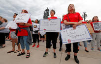 <p>Protesters hold signs in support of Philando Castile during a rally on the capitol steps after a jury found St. Anthony Police Department officer Jeronimo Yanez not guilty of second-degree manslaughter in the death of Castile, in St. Paul, Minnesota, U.S. June 16, 2017. (Eric Miller/Reuters) </p>