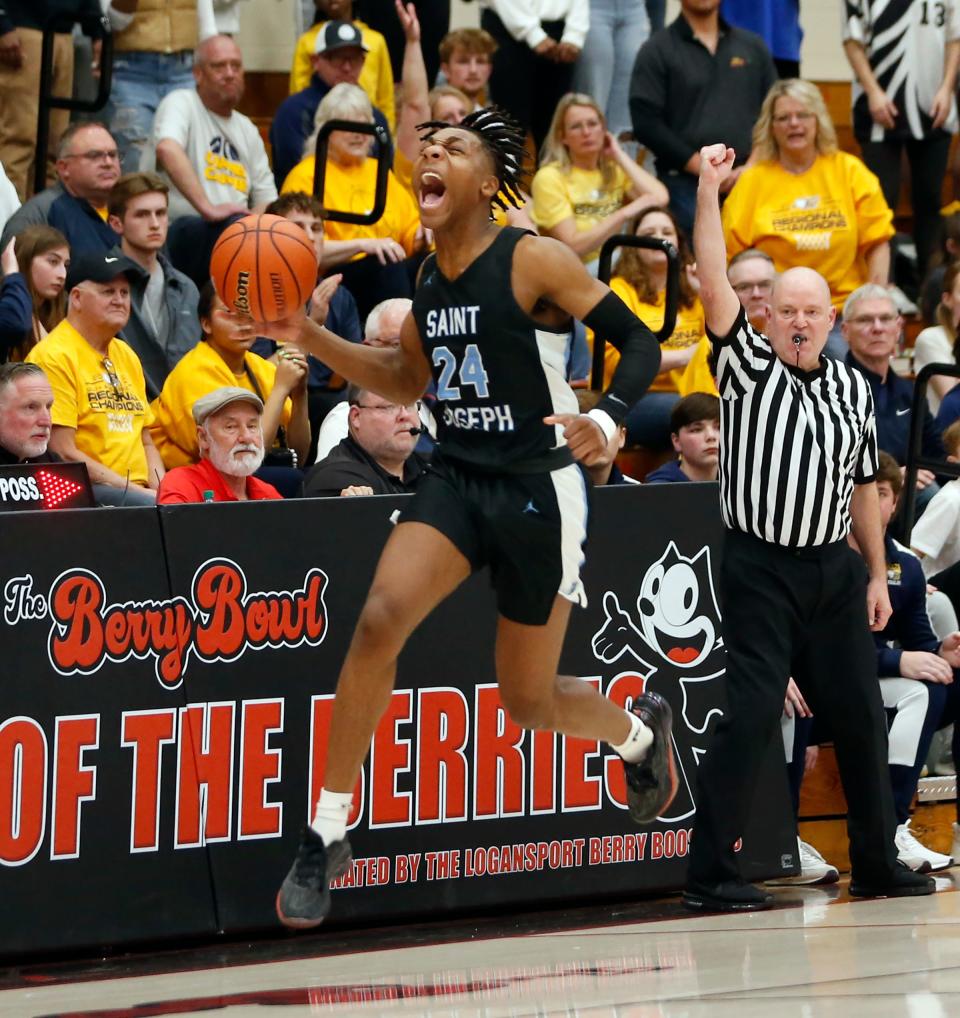 Saint Joseph senior Jayce Lee celebrates after a play in the third overtime of an IHSAA Class 3A boys basketball semistate championship game against Delta Saturday, March 16, 2024, at Logansport High School.