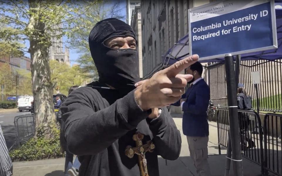 A man wearing a black balaclava was shouting about Jews outside the gates of Columbia University