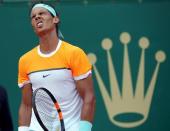 Rafael Nadal of Spain reacts during his semi-final match against Novak Djokovic of Serbia at the Monte Carlo Masters in Monaco April 18, 2015. REUTERS/Jean-Paul Pelissier