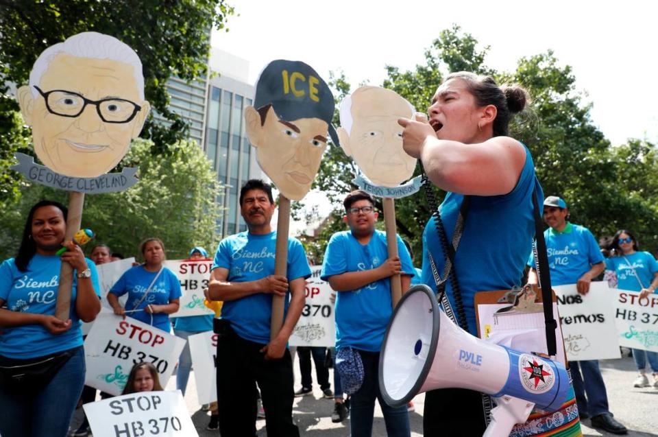 Nikki Marin Baena of Greensboro helps lead a chant during a 2019 rally and march to protest bills that would have required law enforcement agencies to cooperate with immigration authorities.