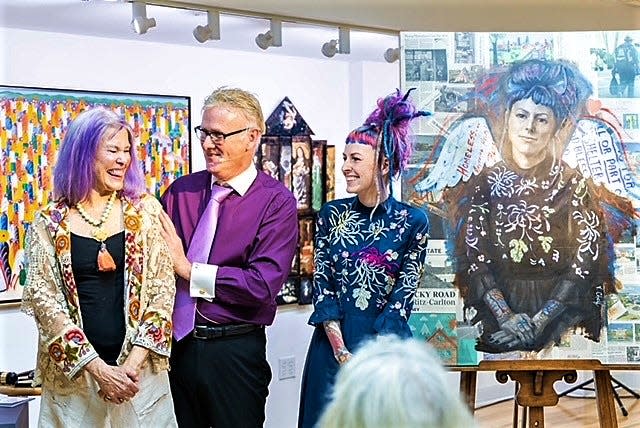The Art Avenue event hosted by gallery owner Paul Sykes featured a painting by Sarasota artist Vicki Chelf, left, in honor of Megan Howell, right, founder and director of Second Heart Homes.