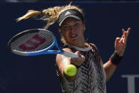 Catherine McNally, of the United States, returns a shot to Karolina Pliskova, of the Czech Republic, during the first round of the US Open tennis championships, Tuesday, Aug. 31, 2021, in New York. (AP Photo/John Minchillo)