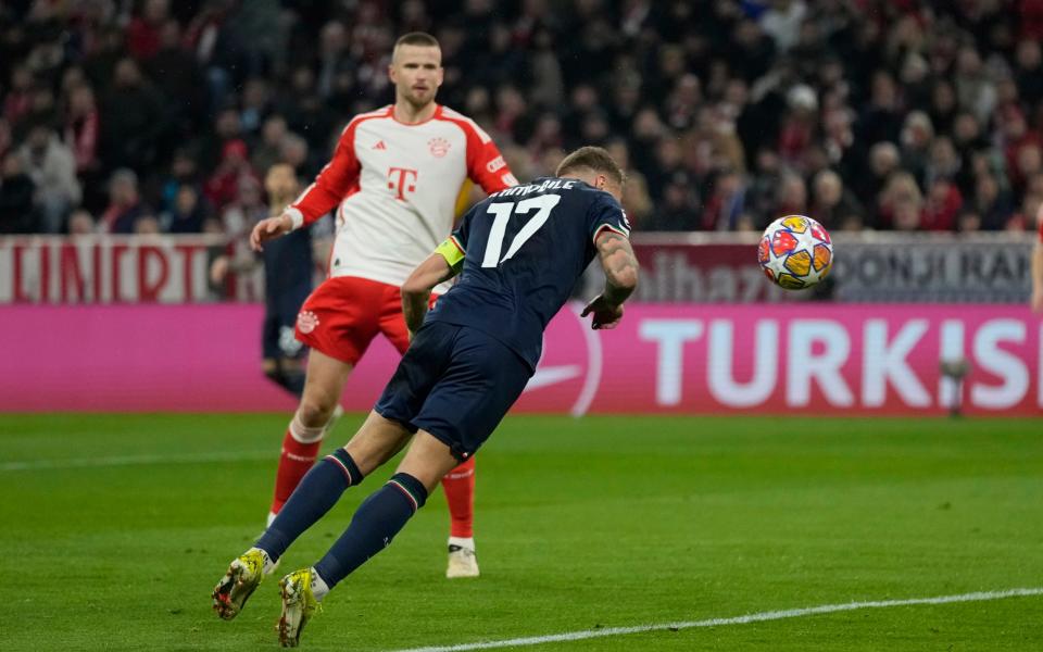 Lazio's Ciro Immobile attempts a head at goal in front of Bayern's Eric Dier and misses during the Champions League