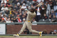 San Diego Padres' Jurickson Profar hits a grand slam against the San Francisco Giants during the first inning of a baseball game in San Francisco, Saturday, April 6, 2024. (AP Photo/Kavin Mistry)