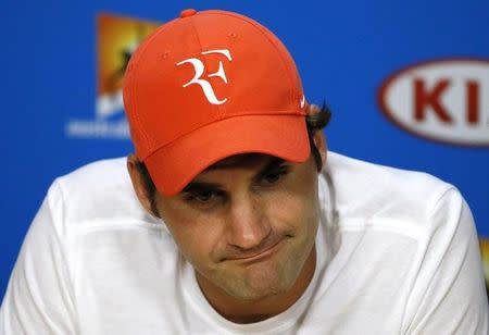 Switzerland's Roger Federer reacts during a news conference after losing his semi-final match against Serbia's Novak Djokovic at the Australian Open tennis tournament at Melbourne Park, Australia, January 28, 2016. REUTERS/Issei Kato