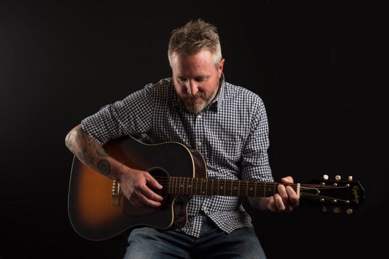 Jeremy Linton took his guitar skills to the South Bend Vet Center, where he and two other volunteers are giving guitar lessons to veterans as part of the national Guitars for Vets program, which is designed to use music to help with symptoms of post-traumatic stress disorder. After 10 lessons, veterans receive a free guitar.