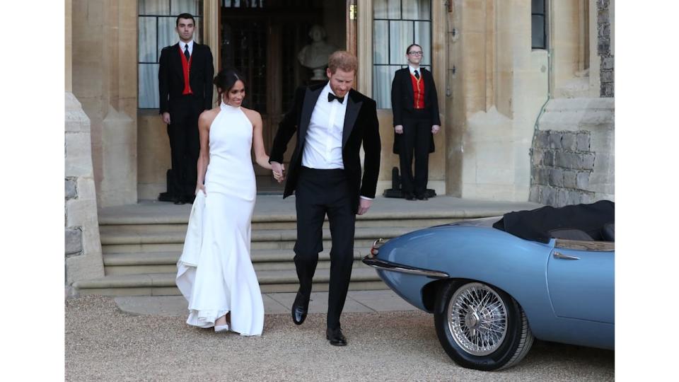 Meghan Markle wears a white halter neck gown at her 2018 with Prince Harry