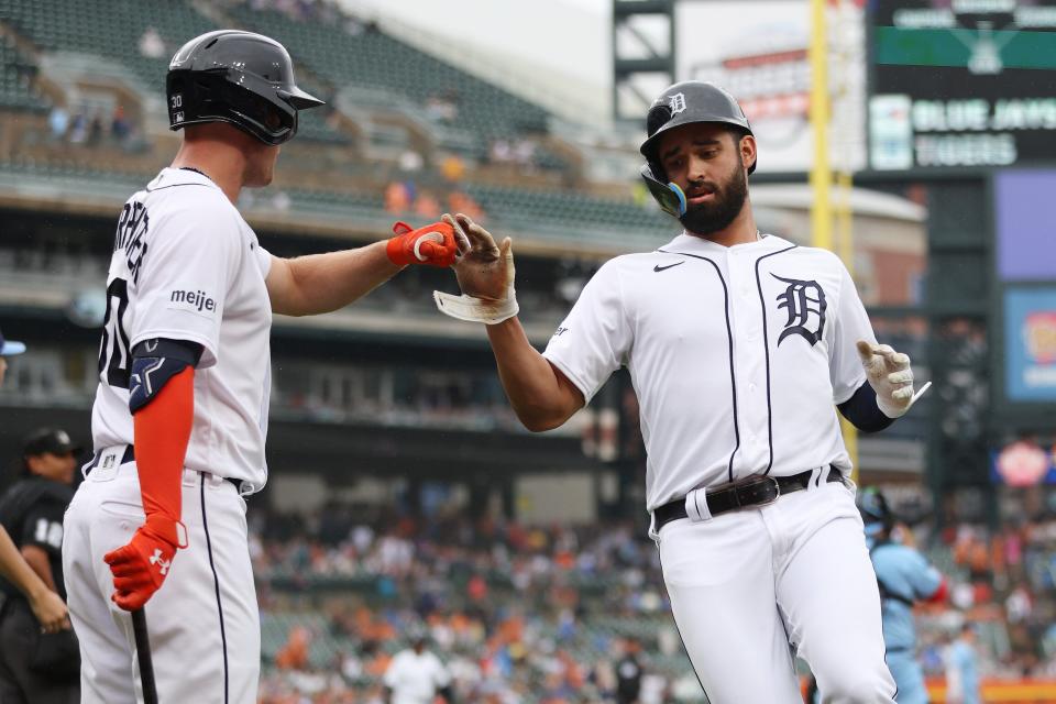 Detroit Tigers' Riley Greene, right, celebrates scoring a first-inning run with Kerry Carpenter, left, in the first inning while playing the Toronto Blue Jays at Comerica Park on July 8, 2023.