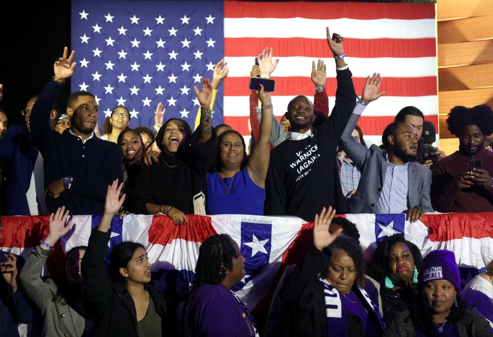 Supporters cheer at an election night watch party for Sen. Raphael Warnock (D-GA) at the Marriott Marquis on December 6, 2022 in Atlanta, Georgia.