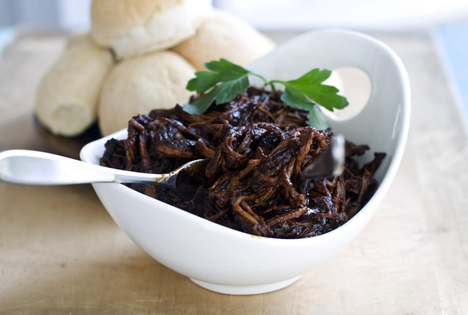 In this image taken on Nov. 12, 2012, sweet-and-tangy barbecue brisket for preparing sliders is shown in a serving bowl in Concord, N.H. (AP Photo/Matthew Mead)