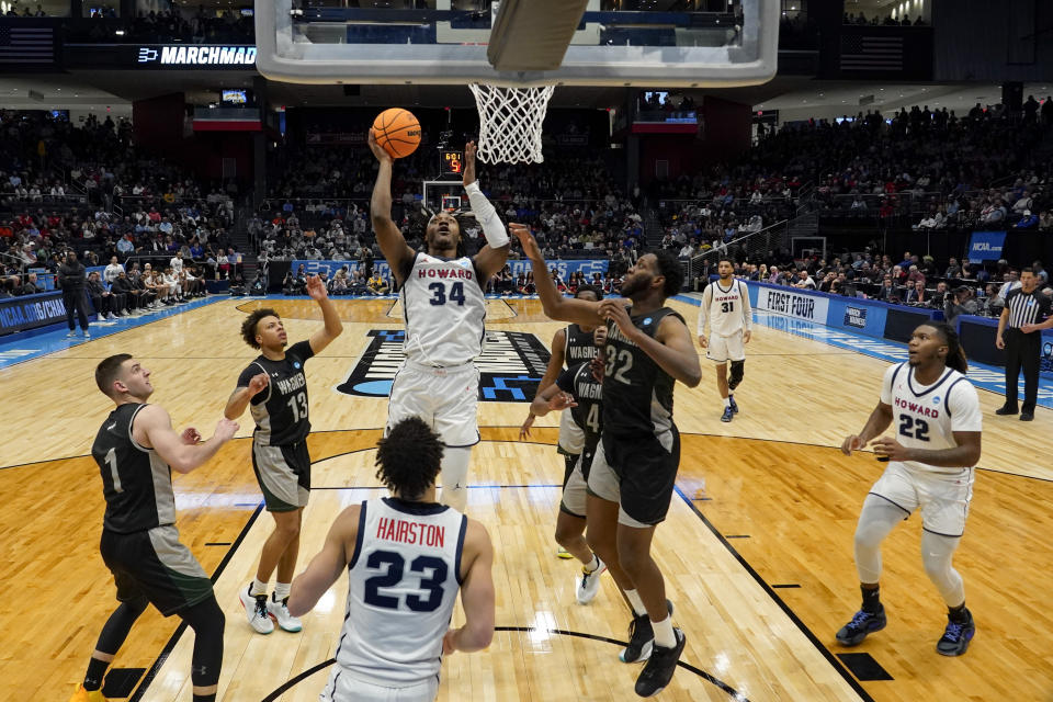 Howard's Bryce Harris (34) shoots against Wagner's Keyontae Lewis (32) during the second half of a First Four college basketball game in the men's NCAA Tournament, Tuesday, March 19, 2024, in Dayton, Ohio. (AP Photo/Jeff Dean)