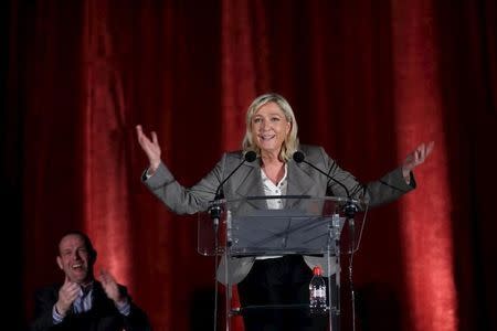 France's far-right National Front leader Marine Le Pen gestures as she speaks during a political rally as part of the campaign for the second round in the French local elections in Henin-Beaumont, northern France, March 25, 2015. REUTERS/Pascal Rossignol