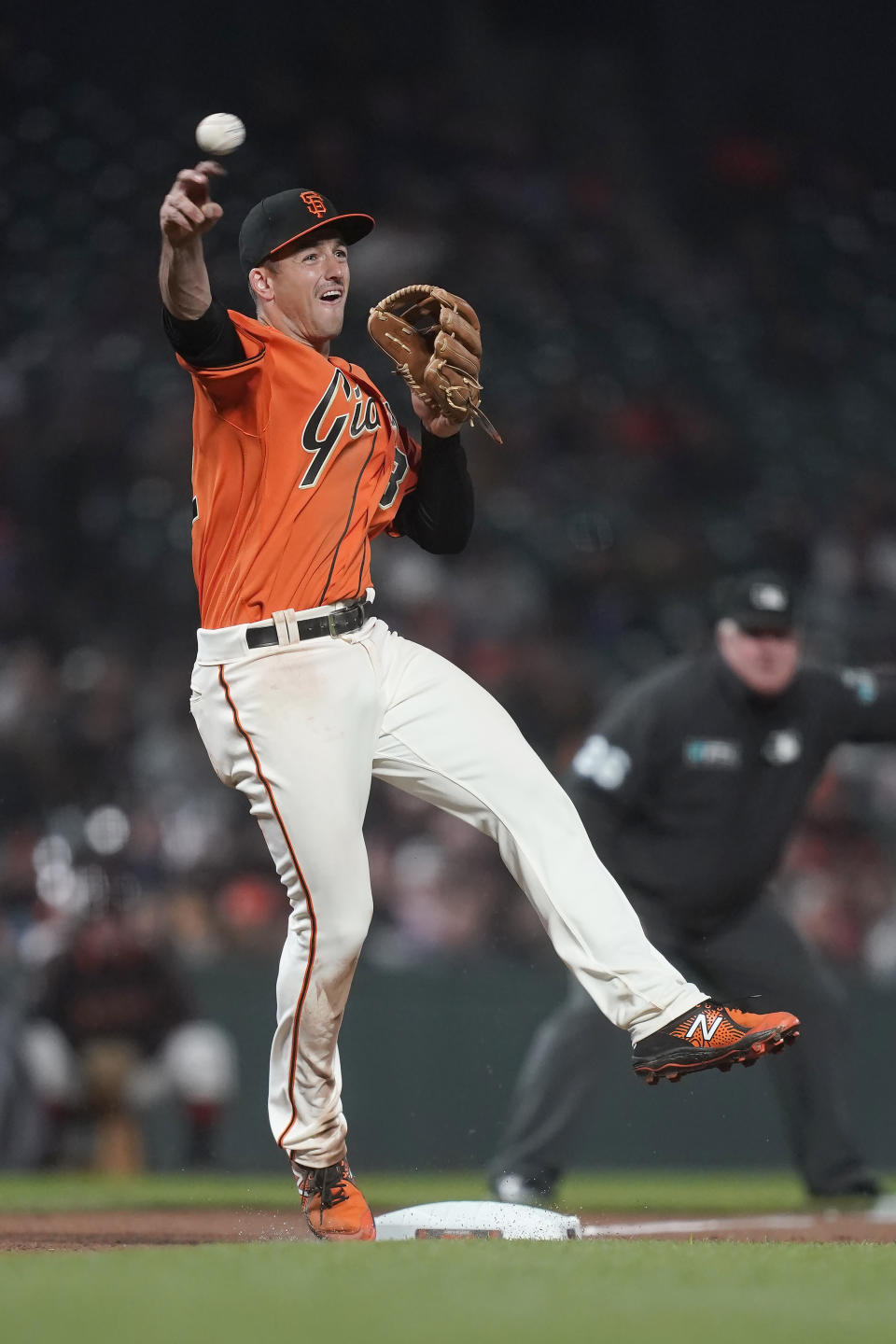 San Francisco Giants third baseman Jason Vosler throws out St. Louis Cardinals' Juan Yepez at first base during the seventh inning of a baseball game in San Francisco, Friday, May 6, 2022. (AP Photo/Jeff Chiu)