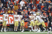 Syracuse running back Sean Tucker (34) is chased by Boston College defensive back Jason Maitre (3) while running during the second half of an NCAA college football game in Syracuse, N.Y., Saturday, Oct. 30, 2021. (AP Photo/Joshua Bessex)