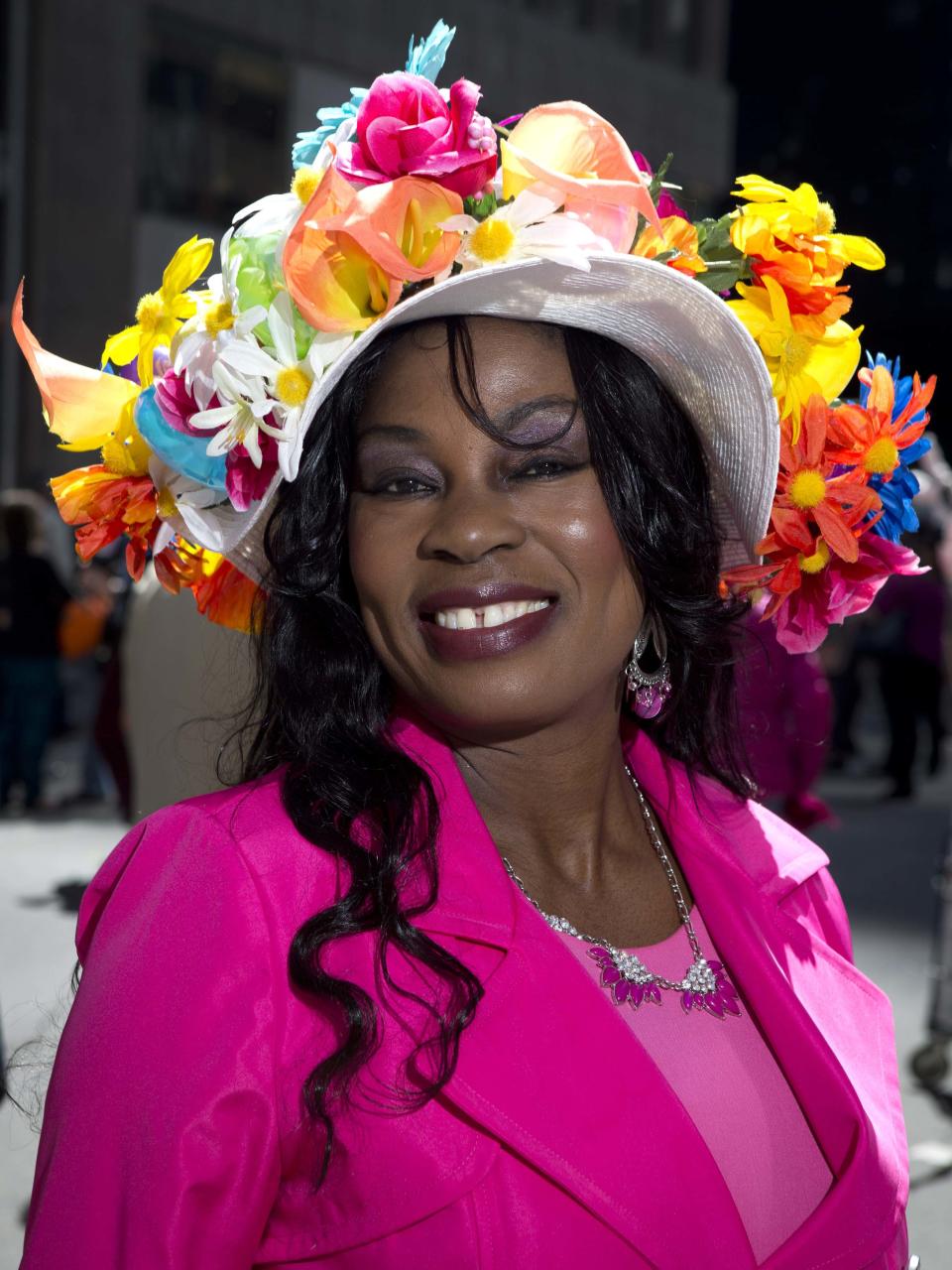 A woman poses for a portrait as she takes part in the annual Easter Bonnet Parade in New York April 20, 2014. REUTERS/Carlo Allegri (UNITED STATES - Tags: SOCIETY RELIGION)