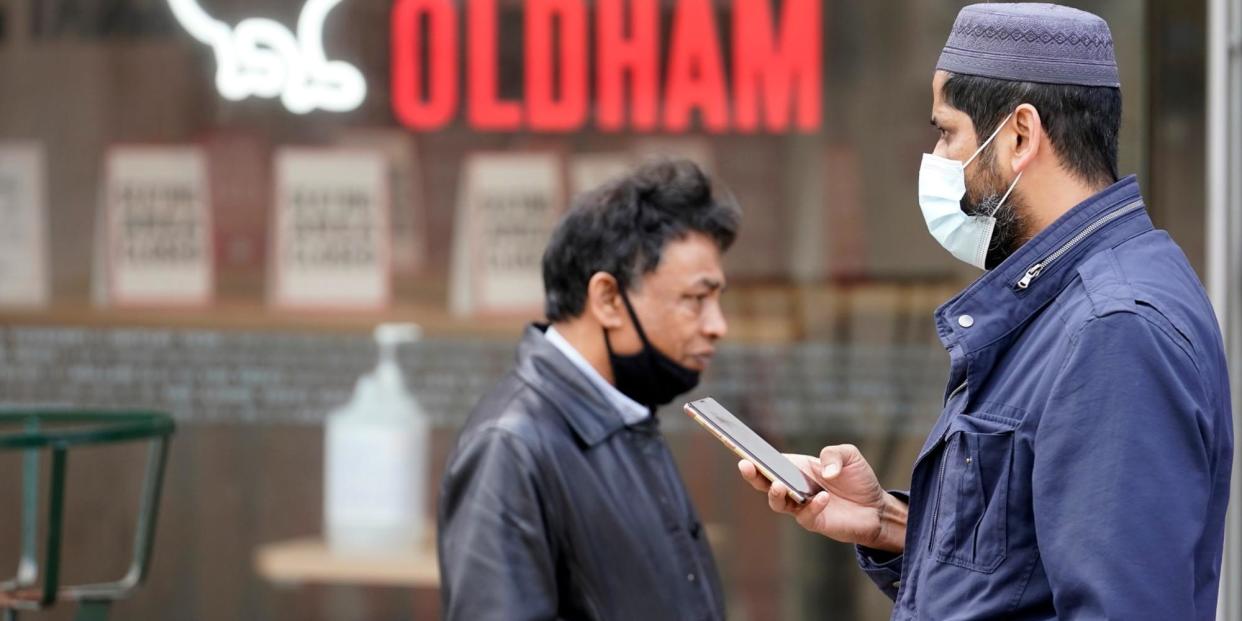 People wear face masks as they go about their daily lives Oldham, Manchester on July 29, 2020: Getty Images