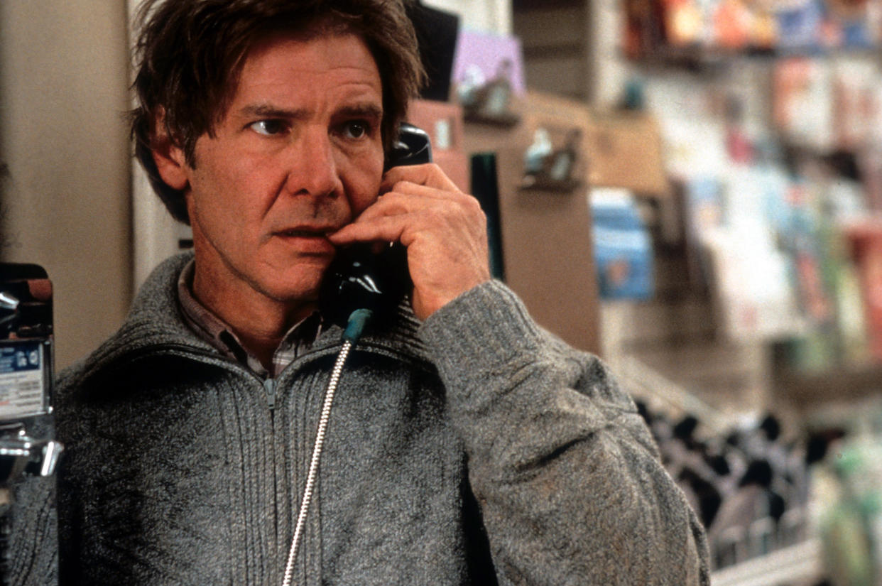 Harrison Ford on pay phone in a scene from the film 'The Fugitive', 1993. (Photo by Warner Brothers/Getty Images)