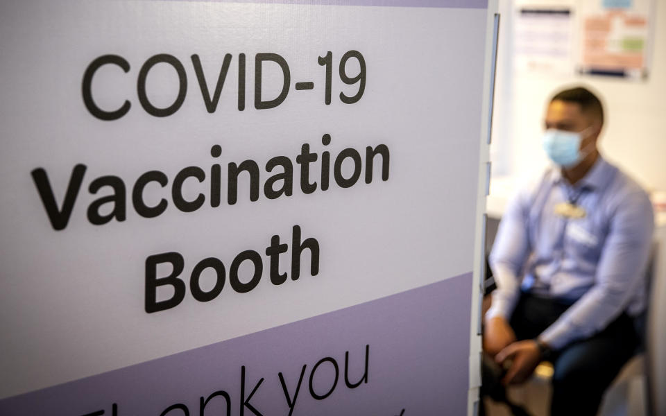 A patient waits to receive his COVID-19 vaccine at the Manurewa Marae vaccination center in south Auckland, New Zealand, April 8, 2021. Some wealthy nations that were most praised last year for controlling the coronavirus are now lagging far behind in getting their people vaccinated — and some, especially in Asia, are seeing COVID-19 cases grow. (Michael Craig/New Zealand Herald via AP)