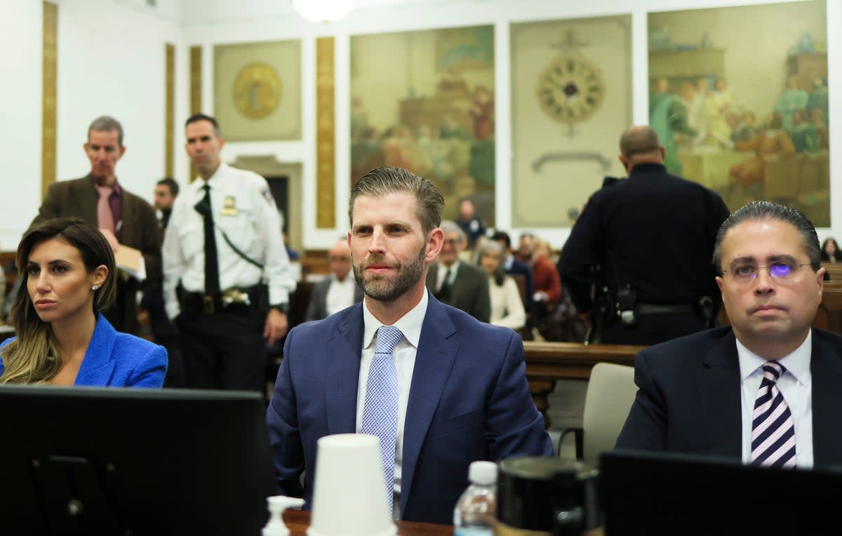 Eric Trump is pictured between his attorneys at the defence table moments before his testimony in a civil trial for fraud in New York Supreme Court (EPA)
