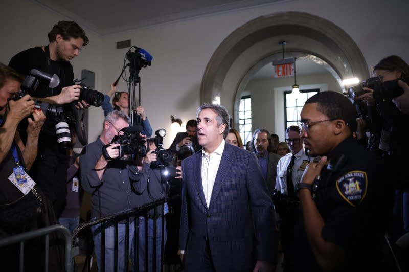 News photographers capture former President Donald Trump's former lawyer Michael Cohen as he arrives in court to testify in the $250 million civil fraud case on Tuesday in New York City. Photo by John Angelillo/UPI