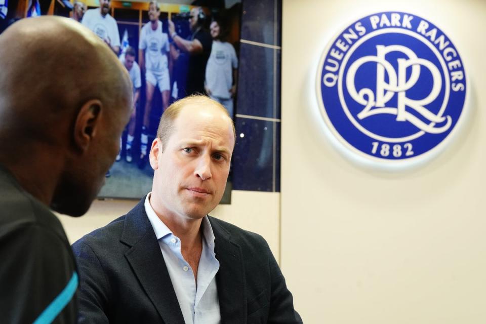 Prince of Wales speaks with staff during a visit to Queen's Park Rangers (Getty Images)