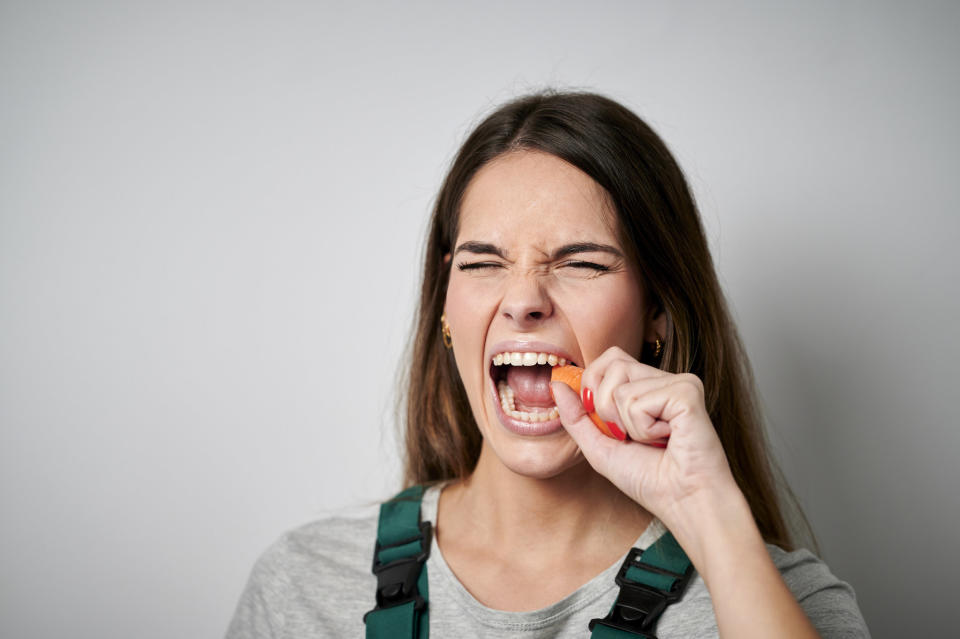 someone eating a carrot