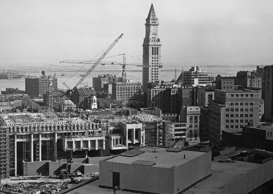 The Custom House Tower rises above cranes and construction work in Boston.