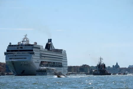 The cruise ship MSC Opera loses control and crashes against a smaller tourist boat at the San Basilio dock in Venice