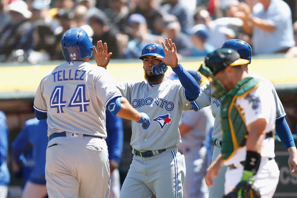 OAKLAND, CA - APRIL 20: Rowdy Tellez #44 of the Toronto Blue Jays celebrates with Teoscar Hernandez #37 after hitting a three-run home run in the top of the fourth inning against the Oakland Athletics at Oakland-Alameda County Coliseum on April 20, 2019 in Oakland, California. (Photo by Lachlan Cunningham/Getty Images)