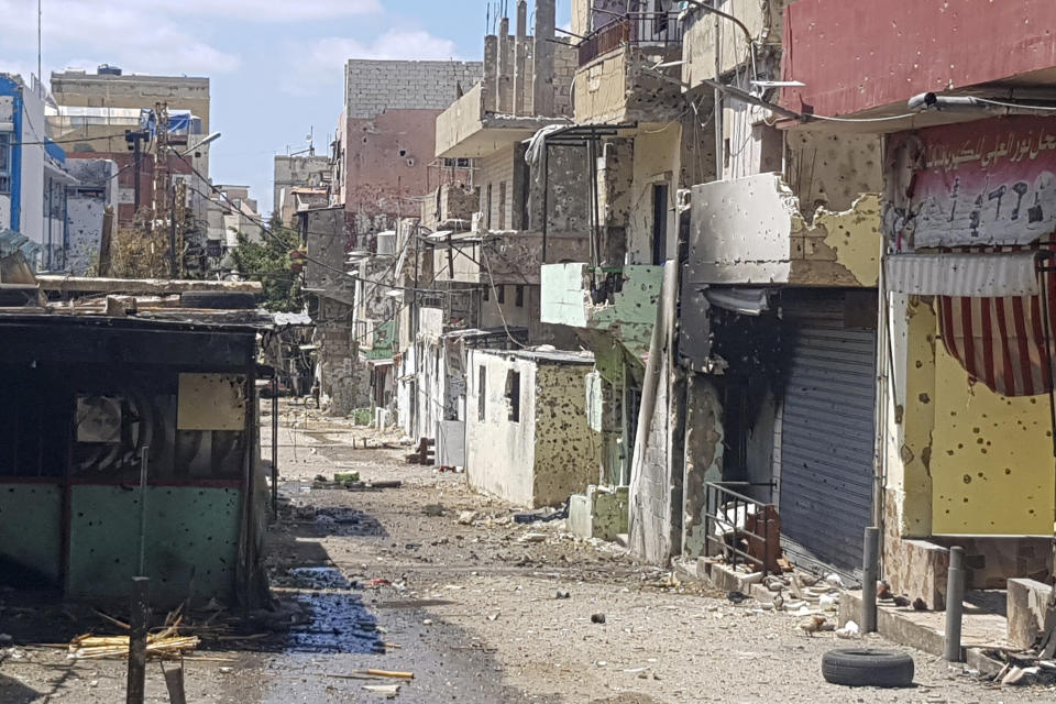 FILE - Houses riddled with bullets are seen after the deadly clashes between Palestinian factions in the Palestinian refugee camp of Ein el-Hilweh near the southern port city of Sidon, Lebanon, Thursday, Aug. 3, 2023. The United Nations agency for Palestinian refugees appealed Wednesday, Aug. 30, for $15.5 million to respond to the fallout of clashes in Lebanon's largest Palestinian refugee camp earlier this month. (AP Photo/Mohammad Zaatari, File)