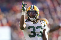 Green Bay Packers running back Aaron Jones (33) signals for a first down during the second half of an NFL football game against the Denver Broncos in Denver, Sunday, Oct. 22, 2023. (AP Photo/David Zalubowski)