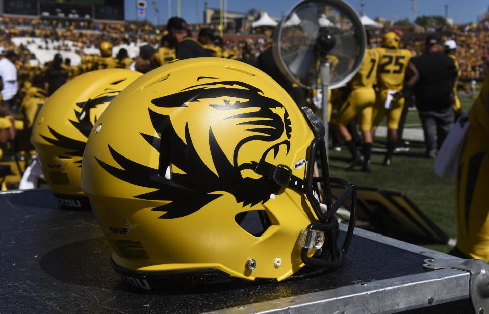 FILE - In this Sept. 22, 2018, file photo, a Missouri football helmet sits on the bench during the second half of an NCAA college football game against Georgia in Columbia, Mo. The NCAA has sanctioned Missouri's football, baseball and softball programs on Thursday, Jan. 31, 2019, after an investigation revealed academic misconduct involving a tutor who completed coursework for athletes. (AP Photo/L.G. Patterson, File)