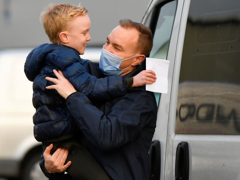 Tom Hayes reacts with his son Josh, after being released from HM Prison Ford, in Arundel