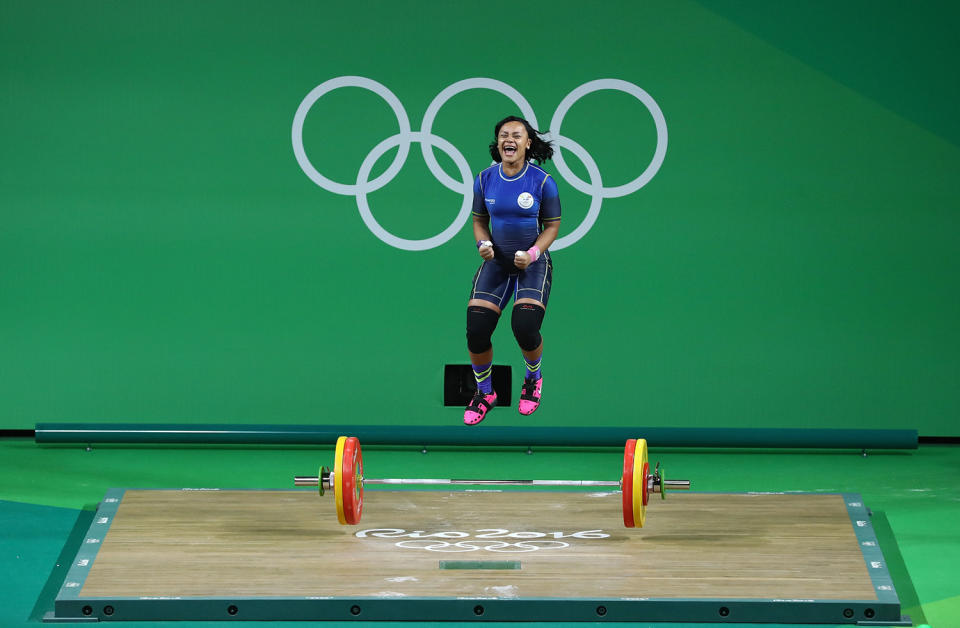 <p>Neisi Patricia Dajomes Barrera of Ecuador celebrates after lifting during the Women’s 69kg Group B weightlifting contest on Day 5 of the Rio 2016 Olympic Games at Riocentro – Pavilion 2 on August 10, 2016 in Rio de Janeiro, Brazil. (Photo by Julian Finney/Getty Images) </p>