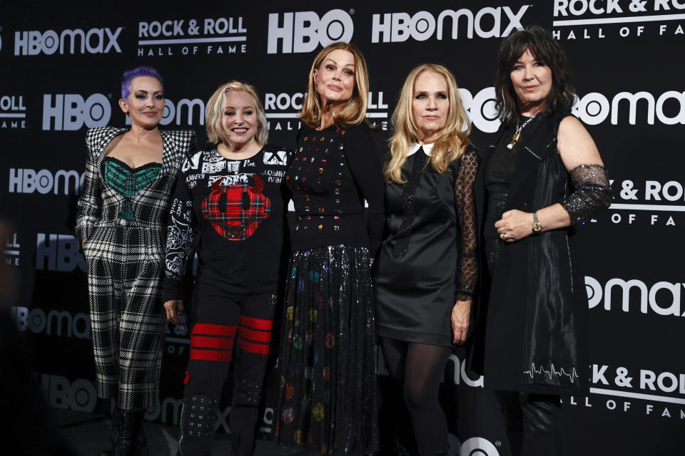 Jane Wiedlin, Gina Schock, Belinda Carlisle, Charlotte Caffey, and Kathy Valentine of The Go-Go’s pose in the press room during the Rock and Roll Hall of Fame induction ceremony, Saturday, Oct. 30, 2021, in Cleveland. - Credit: AP