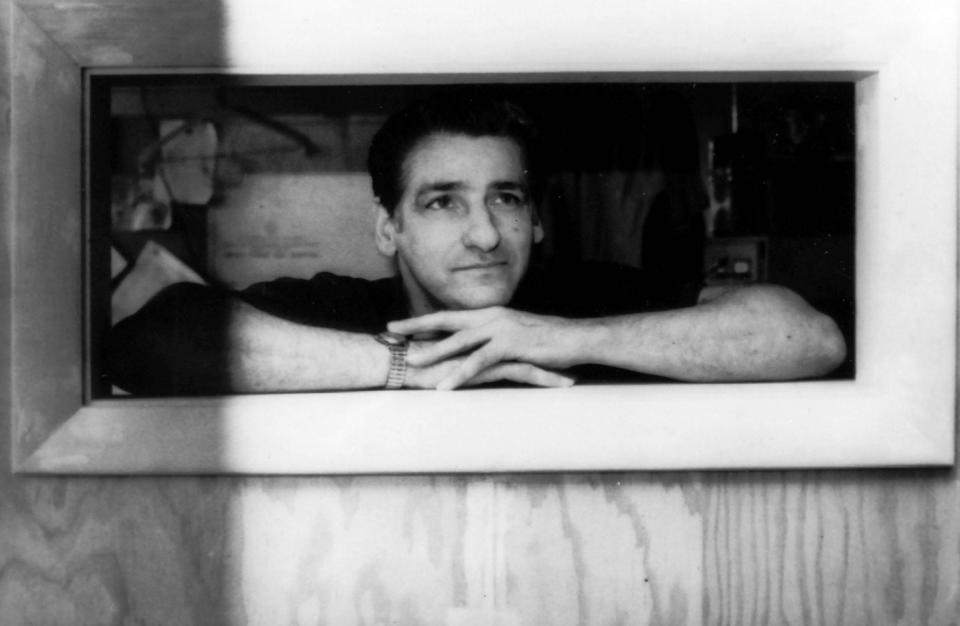 Albert DeSalvo looks out a window while in jail.