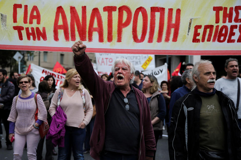 <p>Demonstrators shouts slogans during a demonstration marking a 24-hour general strike against the latest round of austerity in Athens, Greece, May 17, 2017. The banner reads “Subversion”. (Alkis Konstantinidis/Reuters) </p>